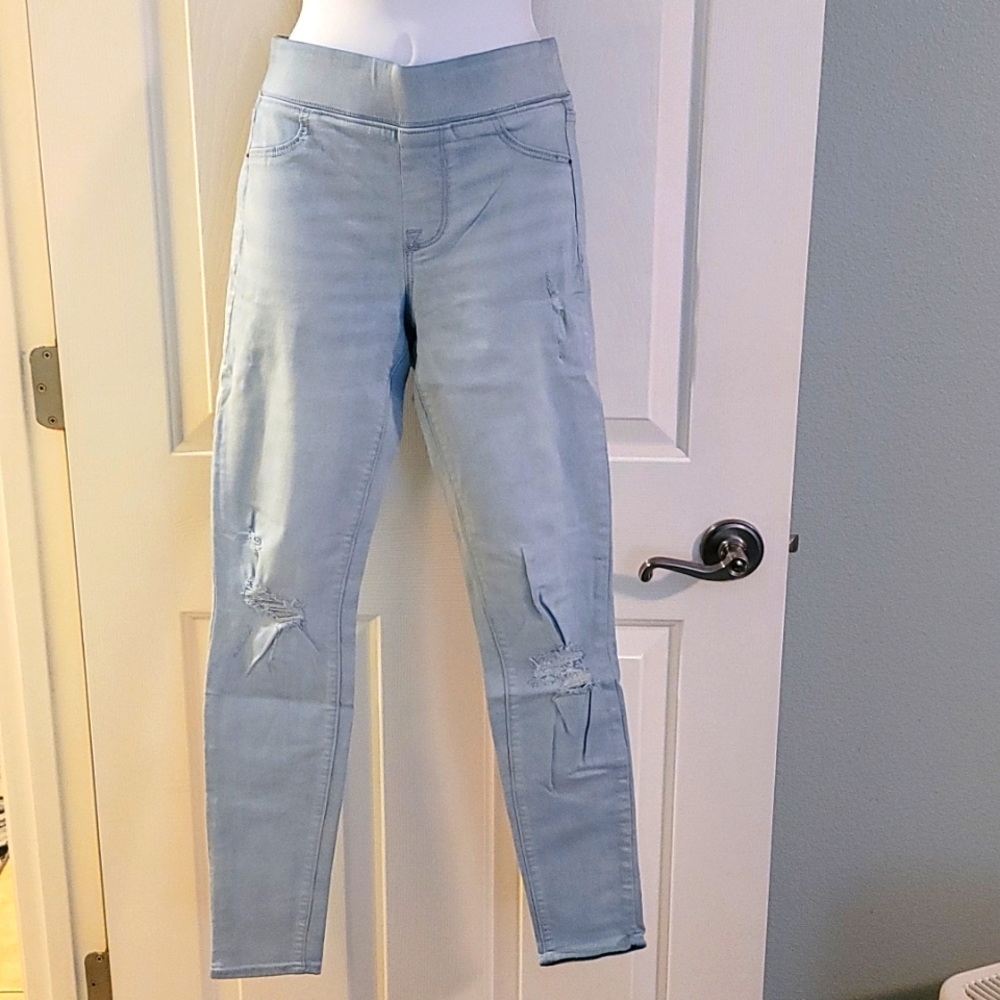 Mid Rise Rockstar Super Skinny Distressed Jeggings.